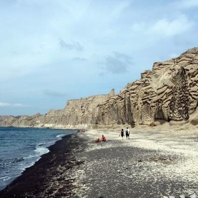 Vlichada beach with washed out bright cliff wall